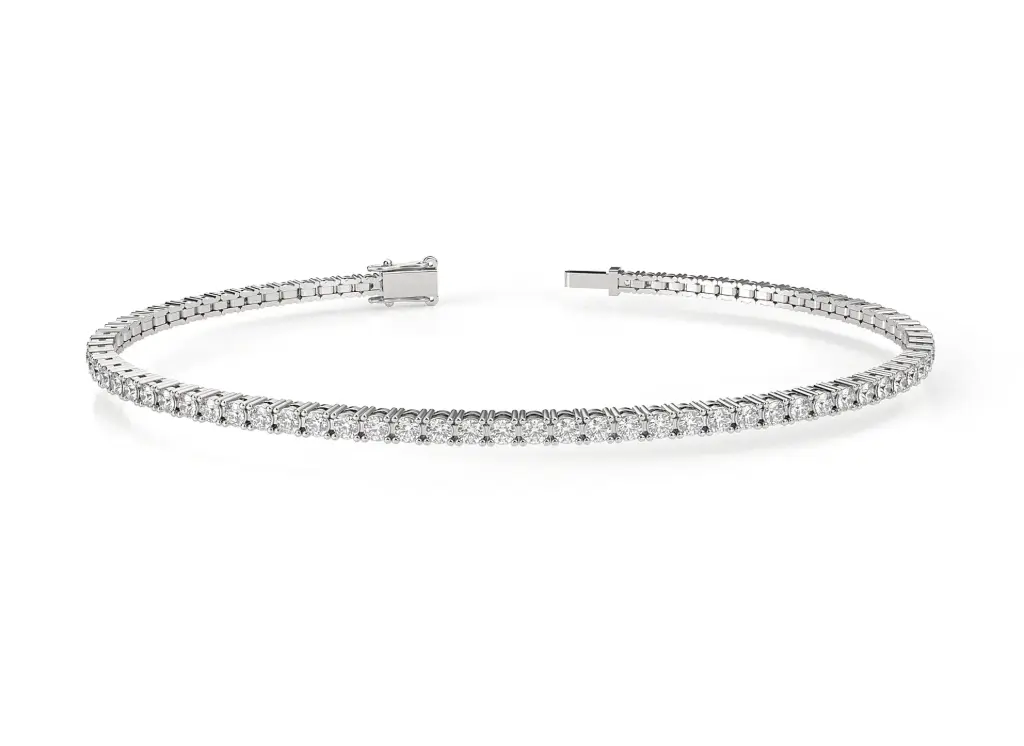 ELYSIA - A classic four-prong round brilliant-cut diamond tennis bracelet set in a sleek two-rail design